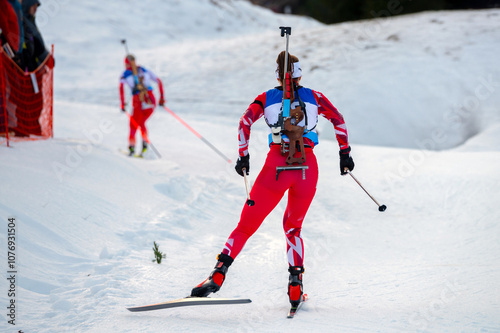 Biathlon athlete on the snowy track while winter sport professional race