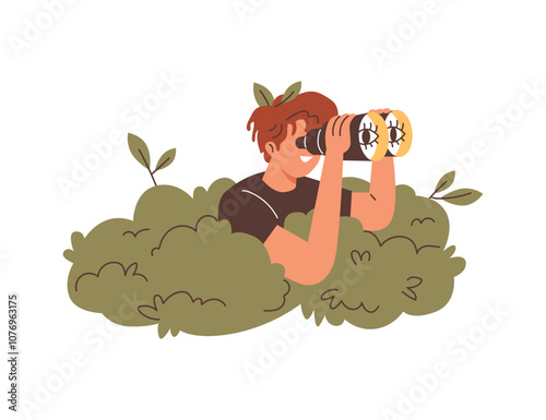 Man looks through binoculars, looking out of a bush.