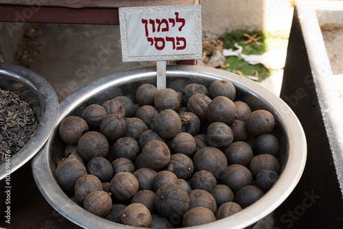 Persian black lemons at a spice market in Tel Aviv, Israel. photo