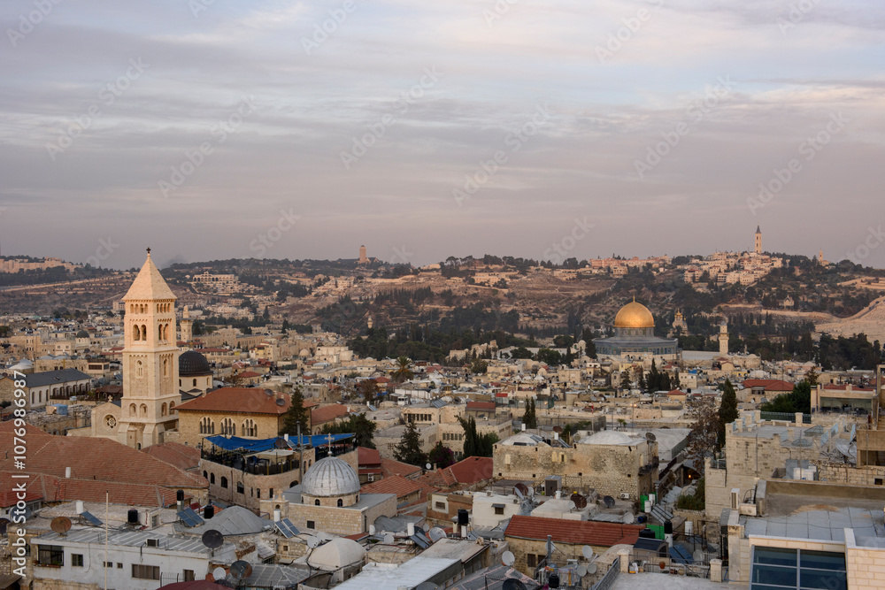 Fototapeta premium Aerial view of the Old City of Jerusalem with the Redeemer Lutheran Church, Dome of the Rock, and Mount Scopus in the distance.