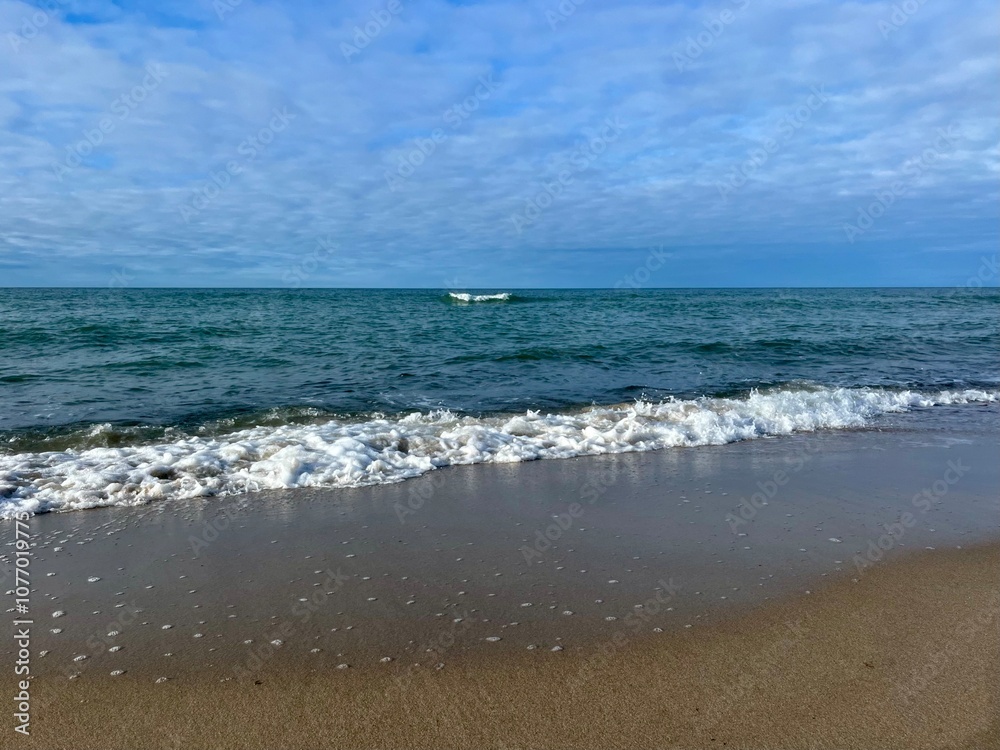 blue seascape, sandy shoreline, white clouds at the sky, seashore blue seascape, sandy shoreline, white clouds at the sky, seashore