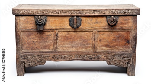 Antique wooden chest with ornate carvings and metal hardware, isolated on white background.