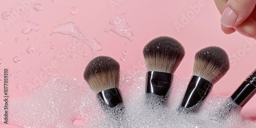 A person cleaning or washing their makeup brushes with brush cleaner.