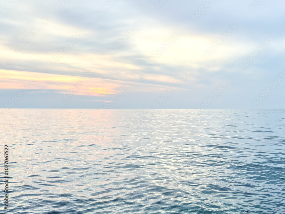 Fototapeta premium Calm sea under a sunset sky. waterline. sea water surface. mockup. product display. minimalistic. abstract background. horizontal