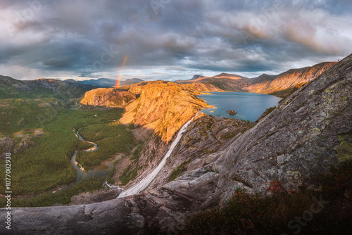 Rainbow over the iconic waterfall Vaerivassfossen (Rago - Norway) photo