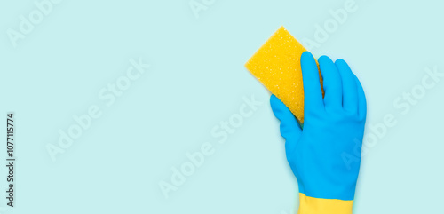 Cleaning services, hand with a yellow sponge