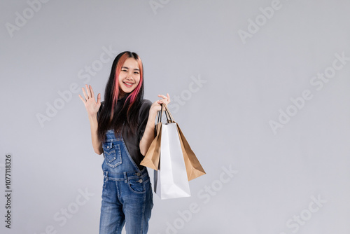 After purchasing the goods, a young woman called someone. photo