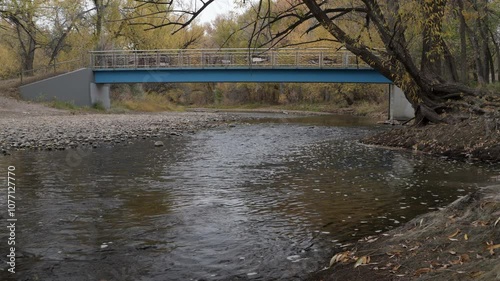 Footbridge over the Poudre River in Fort Collins, Colorado in late fall scenery