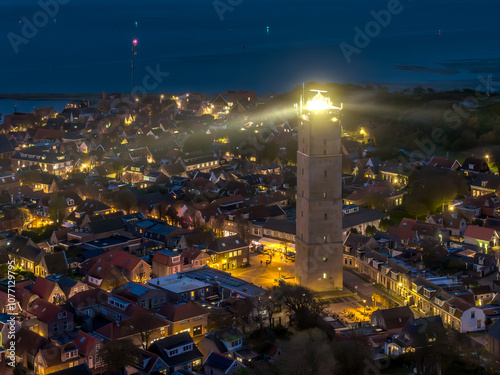 Aerial night photo of lighthouse Brandaris at Wadden isle Terschelling photo