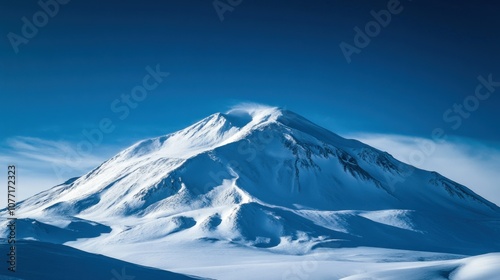 Wallpaper Mural A Majestic Snowy Mountain Peak Against a Clear Blue Sky Torontodigital.ca