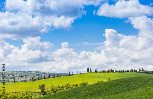 Tuscan house on the hiils with cypresses near Pienza, Italy photo