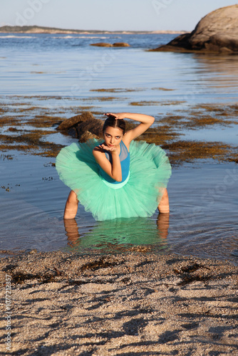 Dancer in shallow ocean water