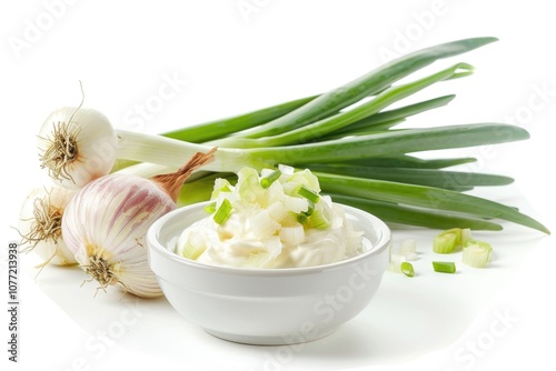 A bowl of creamy mashed potatoes topped with sautéed onions photo