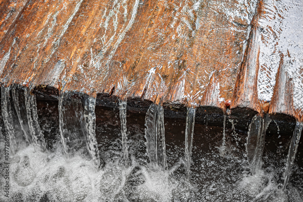 River streams flowing over logs. River streams flowing over logs. Creek rapids made of logs.