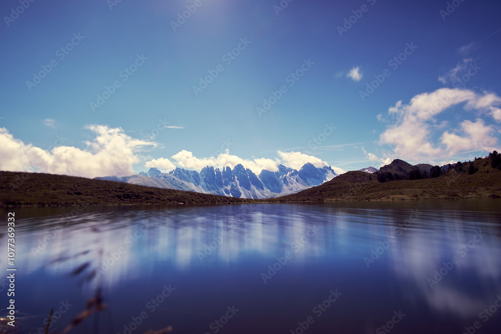 Majestic mountains reflecting in a serene lake under a clear blue sky in the Peruvian Andes Majestic mountains reflecting in a serene lake under a clear blue sky in the Peruvian Andes