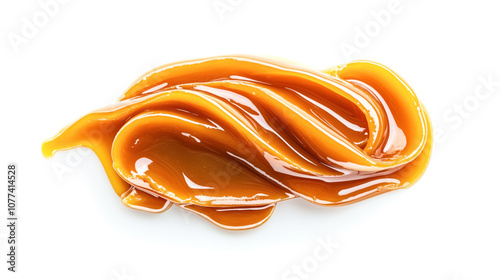 Close-up of smooth glossy caramel spread on a white background with a rich amber color and shiny texture. photo