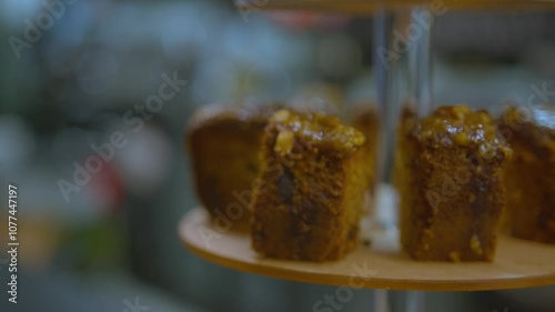 Professional organising slices of cake on a display tower