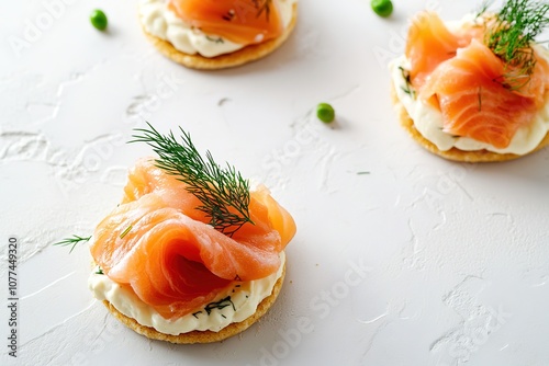 Fresh salmon appetizers on crisp crackers with dill photo