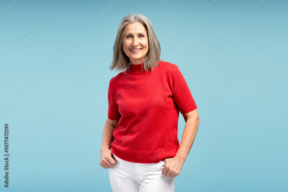 Smiling, beautiful, senior woman wearing casual outfit, red sweater, looking at camera fashion model Smiling, beautiful, senior woman wearing casual outfit, red sweater, looking at camera fashion model