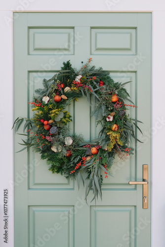 Welcoming door adorned with a vibrant festive wreath