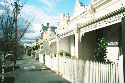 Charming row of terrace home along a sunny Melbourne suburban street photo