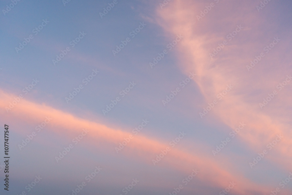 Soft Pastel Clouds Against Blue Sky At Dusk Soft Pastel Clouds Against Blue Sky At Dusk