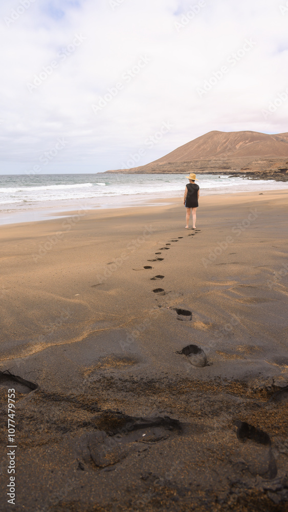 Mature Woman Walking in the Sand Mature Woman Walking in the Sand