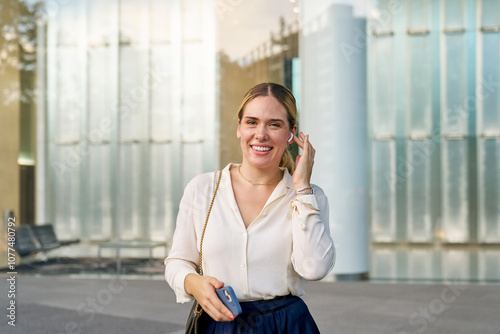 business woman on ear pods phone call photo