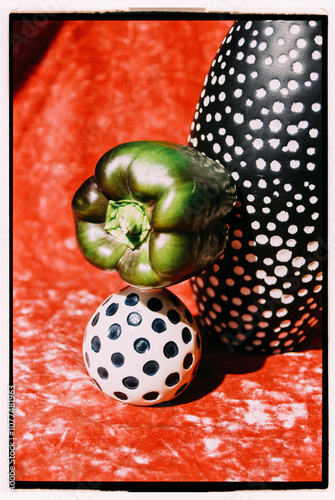 Colorful arrangement of polka-dotted items on a vibrant red surface. photo