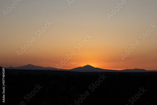 Sunset glow behind mountain range in Oregon