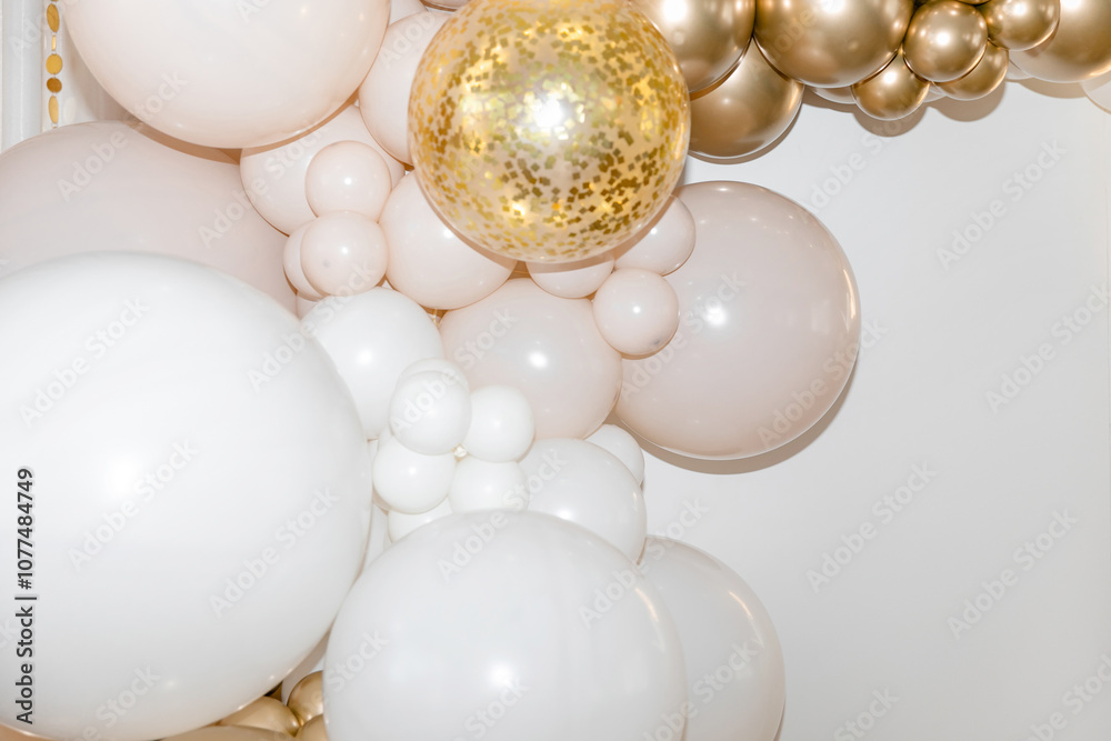 White and gold balloons with confetti on a white background are creating an elegant and festive atmosphere. Background. Festive background. White and gold balloons with confetti on a white background are creating an elegant and festive atmosphere. Background. Festive background.
