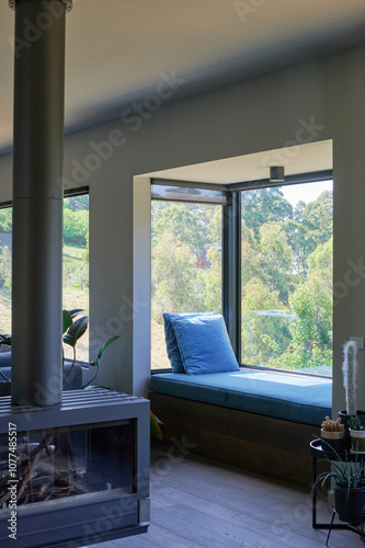 Contemporary daybed with forest view in luxury home photo