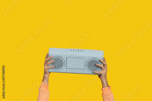 Blue boombox stereo held by hands. Music concept. photo