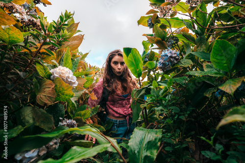 Woman hiking among forest vegetation photo