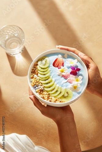 Blue Spirulina Smoothie Bowl with Fresh Fruits and Edible Flowers