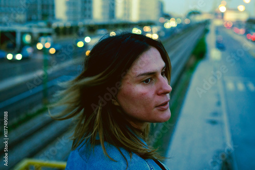 Woman Looking Thoughtfully at Cityscape  photo