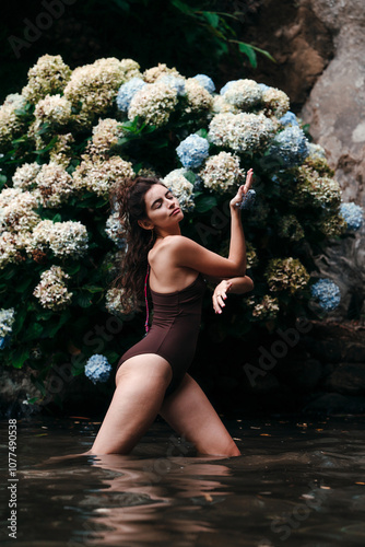 Dancing in nature among flowers in the pond photo