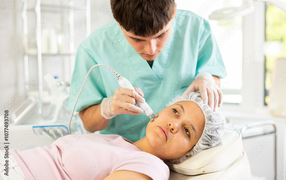 With precision and expertise, cosmetic doctor utilizes RF lifting attachment to deliver skin-tightening procedure, leaving client with visible and satisfying results. With precision and expertise, cosmetic doctor utilizes RF lifting attachment to deliver skin-tightening procedure, leaving client with visible and satisfying results.
