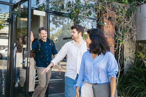 Teamwork leaving the office after a workday photo