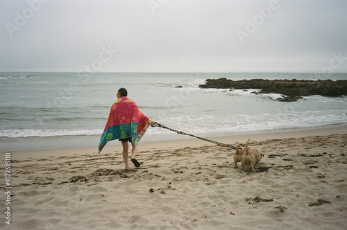 35 mm walking dog on beach photo