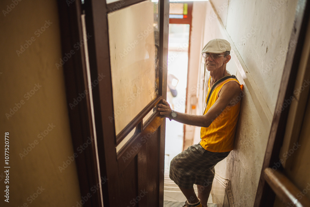 Cuban man entering bar through stairs Cuban man entering bar through stairs
