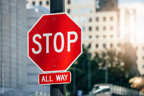 Stop sign in bustling New York with blurred building background photo