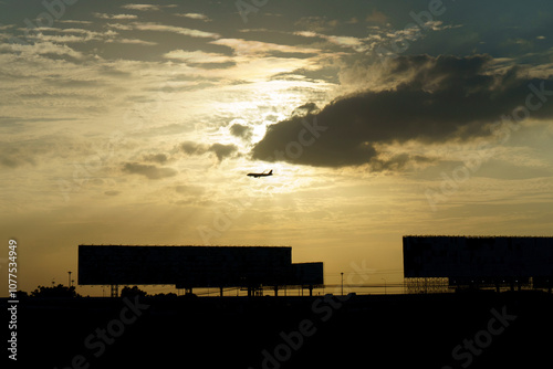 Airplane flying in silhouette photo