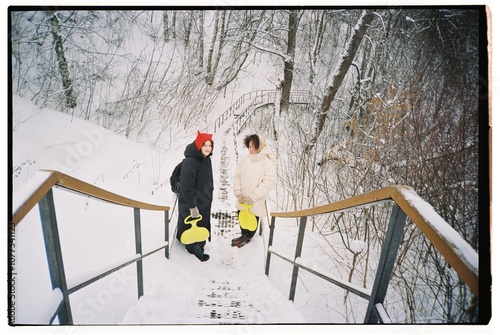 The girls are coming down the stairs  photo