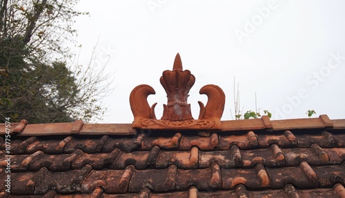 photo of clay roof tiles shaped like a crown photo