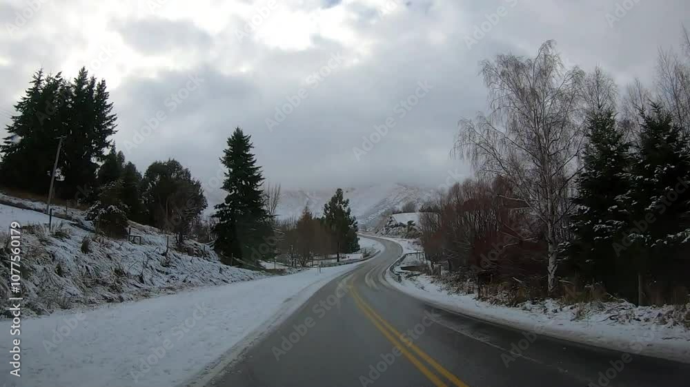 Scenic winter drive along Crown Range Road between Queenstown and Wanaka, Cardrona Oatgo New Zealand, Snow-covered mountains and winding roads serene alpine landscape Scenic winter drive along Crown Range Road between Queenstown and Wanaka, Cardrona Oatgo New Zealand, Snow-covered mountains and winding roads serene alpine landscape