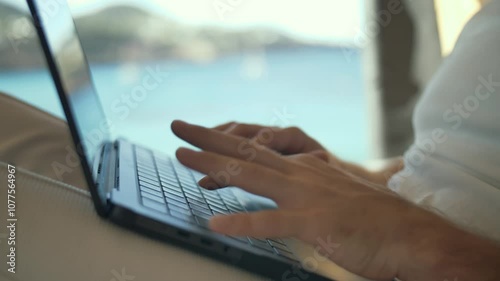 Keyboard focus in a van remote work setup surrounded by scenic landscapes