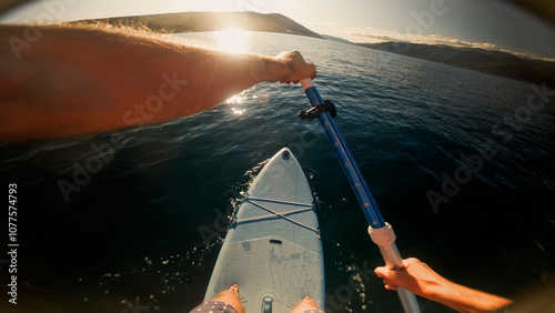 POV of a man using a stand-up paddle board