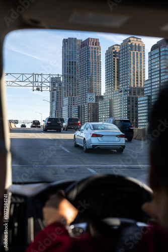Street with cars circulating near the skyscrapers of downtown New York