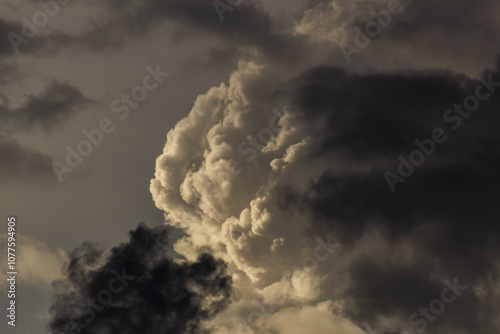 big clouds in the sky before the storm at sunset photo